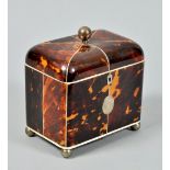 A Regency two compartment tea caddy with a hinged domed cover, ivory line inlay and edging with oval