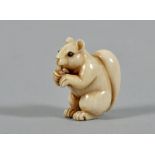 A 19c ivory figure netsuke carved as a squirrel, with black incised signature to base, 1"h.