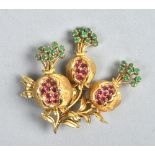 An 18c gold emerald and ruby set pomegranate Nardi brooch.