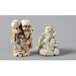 Two late 19c Oriental netsukes , one carved as a seated traveller and the other a robed gentleman