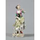 A Meissen figure of a shepherdess with a lamb, very a/f, 8.25"h.