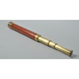 A 19c mahogany cased brass three drawer telescope , 35.5" long extended.