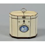 A George III ivory tea caddy of decagonal form, with a Wedgwood blue and white parian oval classical