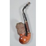 An early 20c Black Forest barrel pipe, the bowl carved with deer in a woodland setting and with