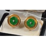 A pair of 14ct gold jade and diamond set cufflinks .