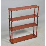 An early 19c mahogany wall bracket fitted three shelves betwixt turned baluster spindles, 24" x 27".