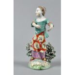 An 18c Derby patch marked bocage figure of a young woman holding a plum, bocage a/f, 8"h.