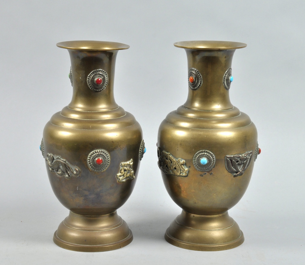 A pair of 19c Indo-Chinese brass vases of baluster form with applied jewels, dragon and other