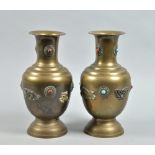 A pair of 19c Indo-Chinese brass vases of baluster form with applied jewels, dragon and other
