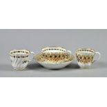 A Flight period Worcester trio of teacup, saucer and coffee cup of spirally fluted form, decorated