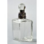 A clear glass diamond shaped decanter with star cut base, with silver collar and lock, Birmingham