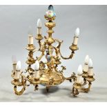 An early 20c eight branch gilt metal and ceramic chandelier electrolier, 24"diam, 28"h.