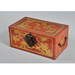 A Japanese red lacquered two handled wedding box, decorated in low relief with birds and animals