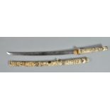 A wakizashi mounted in carved ivory, carved with warriors and other figures, the blade 20.75"l, 31.