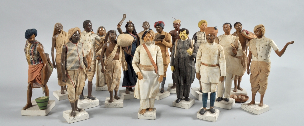 A collection of seventeen 19c North West Indian terracotta miniature figures in costumes of the