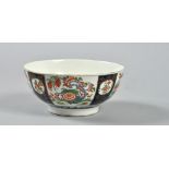 A Worcester bowl decorated with panels in the Rich Kakiemon style between underglazed blue panels,