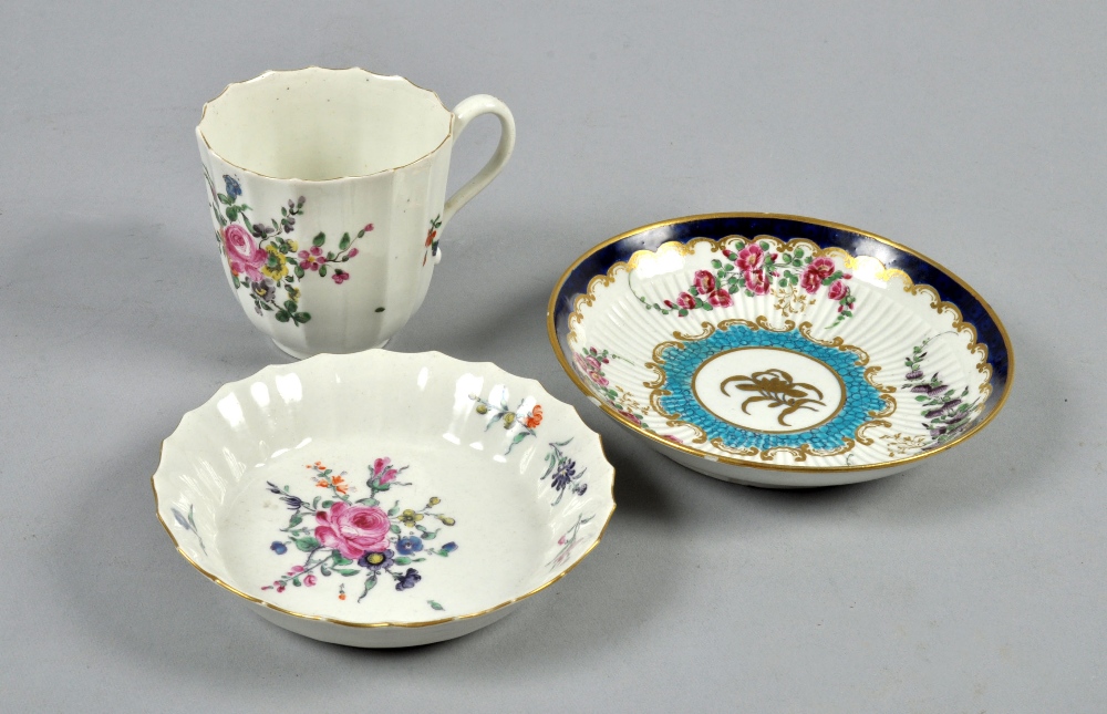 A Worcester fluted coffee cup and saucer painted with a spray of flowers, a/f, square fret mark to
