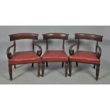 A set of eight (6+2) William IV mahogany dining chairs with curved deep carved top rails, the