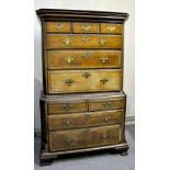 A George III mahogany chest on chest , the upper section having three short and three long graduated