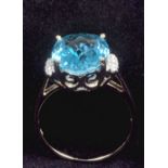 A gold blue topaz and diamond set ring.