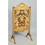 A 19c mid Georgian style giltwood screen carved with scrollwork, leaf and foliate symbols, supported