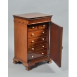 A late 19c inlaid mahogany table top cabinet fitted two short and four long drawers under a