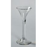 An 18c wine glass with trumpet bowl, plain straight stem and with domed circular foot, 6.75"h.