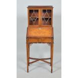 An Edwardian rosewood marquetry bureau bookcase of small form, the bookcase with a three quarter