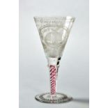 A 19c Dutch commemorative glass with ruby and clear glass twist stem, the bowl engraved 'De Hoop',