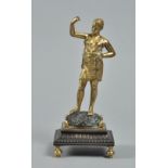 A gilt bronze statuette of Aphrodite standing on a cast mound, on a stepped base with baluster feet,