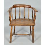 An early 19c ash and elm West Country chair with a low spindled saddle back, with baluster turned
