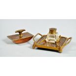 An Art Nouveau Erhard & Sohne bronze and rosewood desk set with a two handled ink stand carrying one