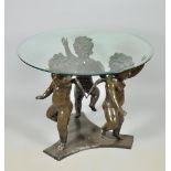 A cherub centre table , the circular glass chamfered table top supported by three patinated bronze