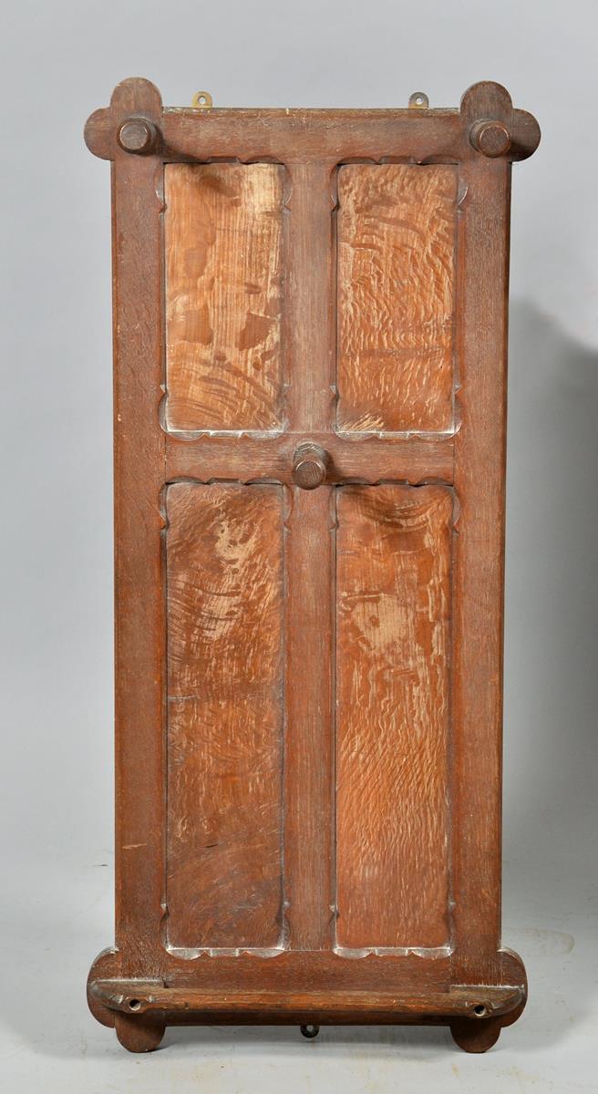 An Arts & Craft oak panel back wall rack, 17"w, 38"h.