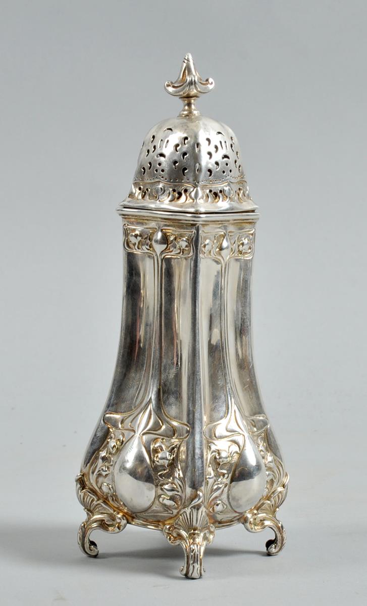 An Art Nouveau sugar caster with a pierced domed cover and urn finial, the body embossed and