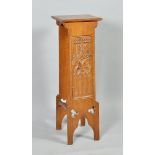 An Arts & Craft oak ecclesiastical lectern with Gothic carved and pierced side panels, 14"w, 42"h.