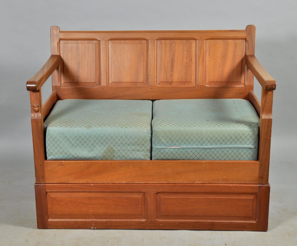 A Colin Beaverman Almack walnut four panel back settee on a box stand, beaver carved, 48"w.