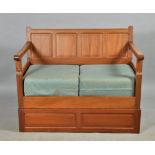 A Colin Beaverman Almack walnut four panel back settee on a box stand, beaver carved, 48"w.