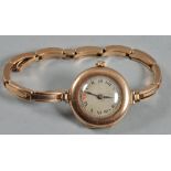 A ladies 9ct gold Rolex manual wrist watch, presented on a 9ct gold strap, model number 742535,