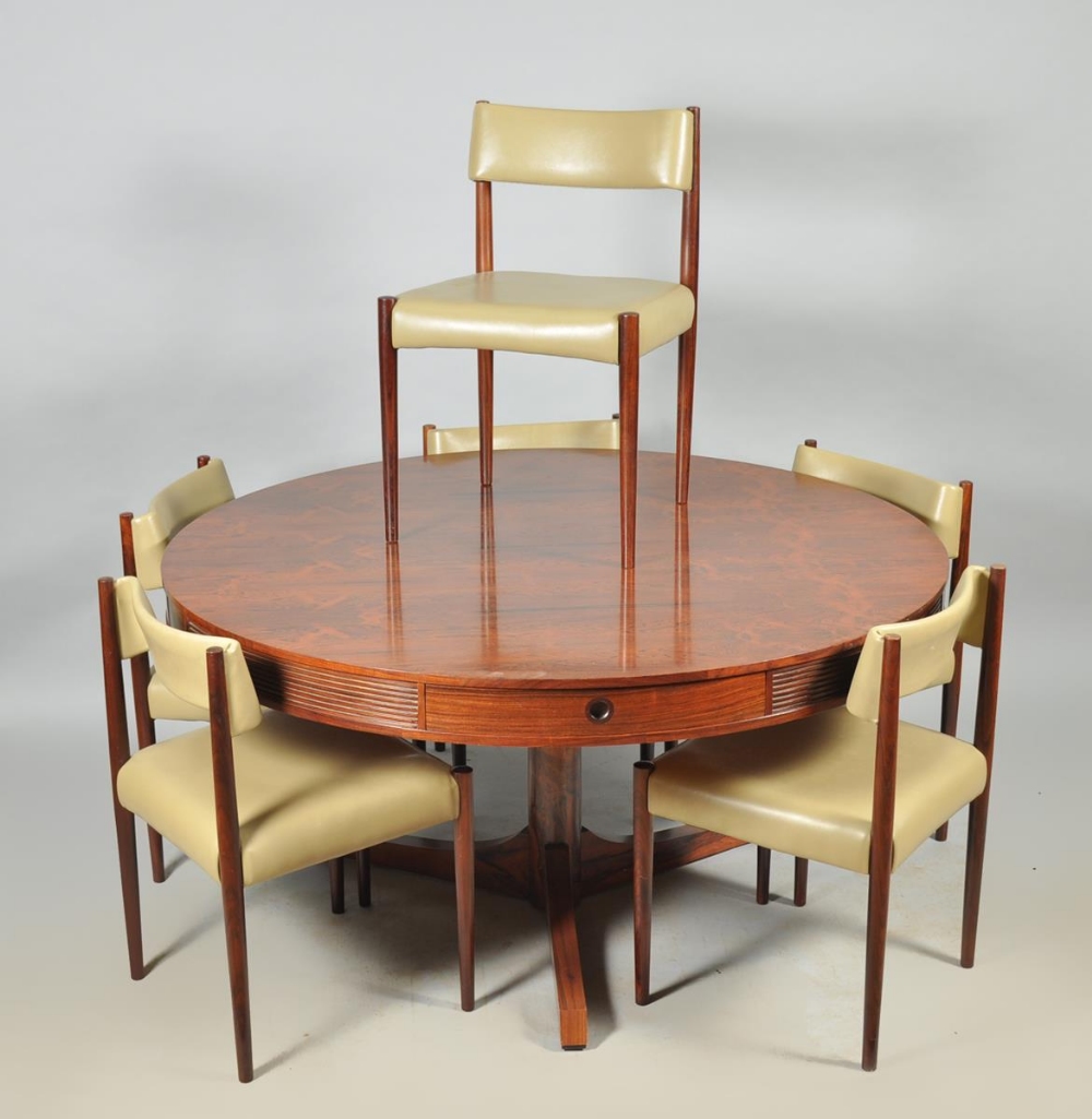 A 1960's Robert Heritage for Archie Shine rosewood drum table, fitted with four drawers, together