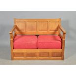 A Colin Beaverman Almack four panel back two seater oak settee, beaver carved, 48"w.