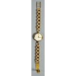 An 18ct gold ladies Rolex cocktail watch on original strap with coronet terminals, the case 18mm