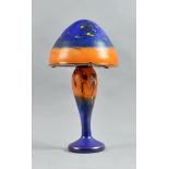 A French Pascal Guyot iridescent and clouded art glass lamp, in blue and orange with trailed