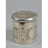 An Art Nouveau silver cylindrical box with lift off cover, the box incised and embossed with