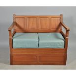 A Colin Beaverman Almack walnut four panel back settee on a box stand, beaver carved, 48"w.