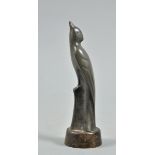 An Art Deco spelter figure of a perched bird, inscribed 'FB' and on wooden base, 7" high overall.