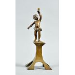 An early 20c bronze figurative lamp stand , the figure cast as a putti on a plinth holding aloft the