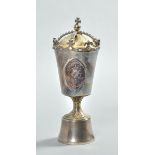 A Queen Elizabeth II Silver Jubilee goblet and cover, manufactured by Pobjoy Mint Ltd. The gilt