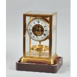 A mid 20c Swiss Jaeger-Le-Coultre Atmos clock in glazed brass four glass style case, the movement