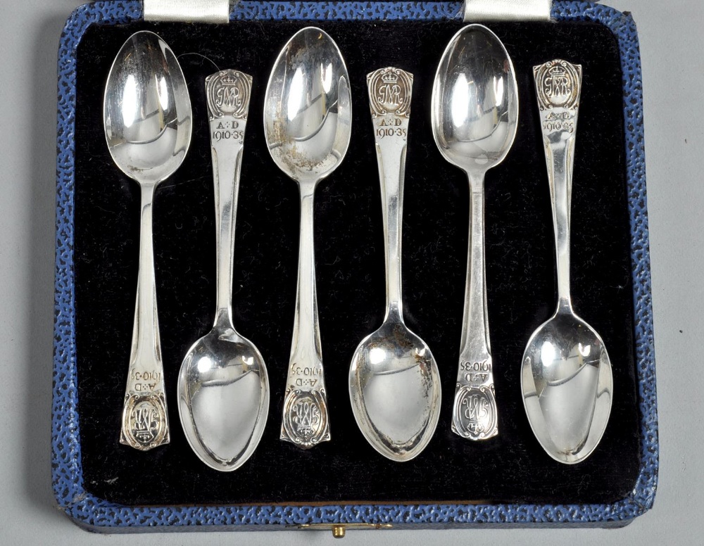 A boxed set of six commemorative teaspoons, the terminals embossed and chased with crowned G, in